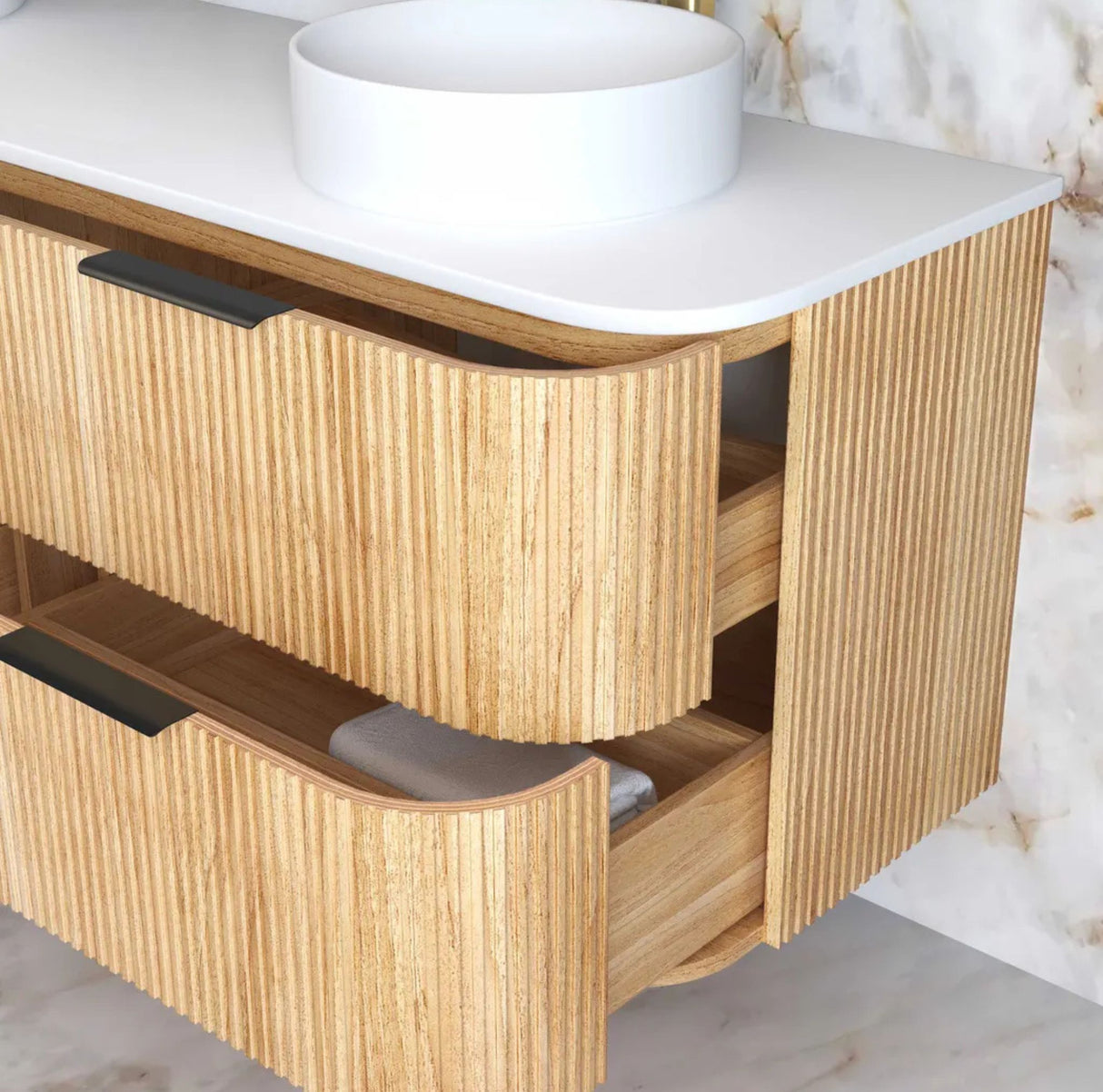 Wooden bathroom vanity with white countertop and round basin.