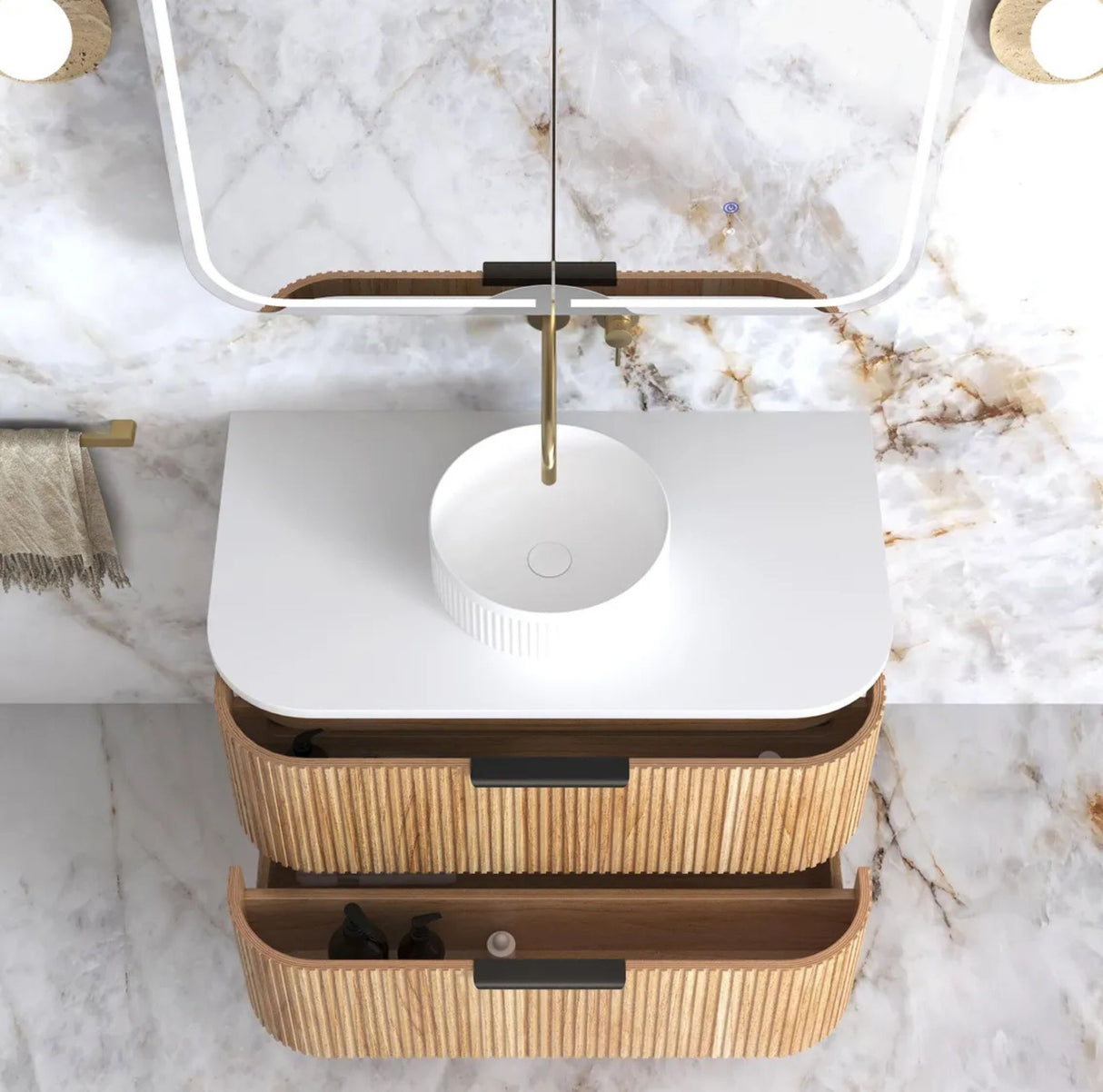 Bathroom vanity with rattan drawers and white countertop on a marble wall background