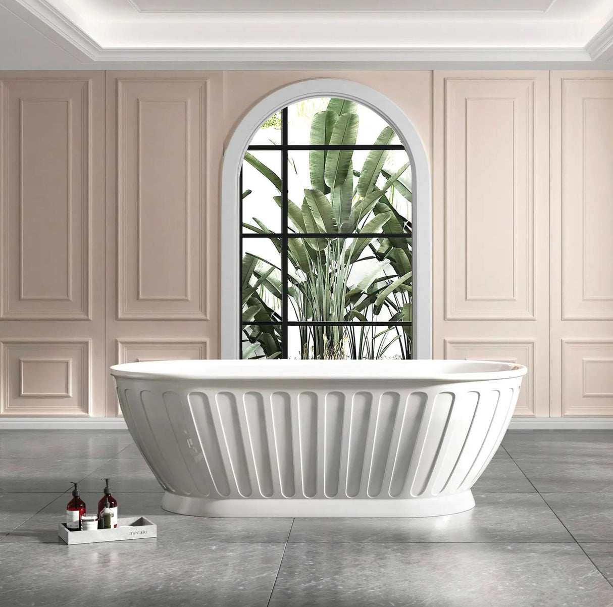 White freestanding bathtub in a modern bathroom with a large window and plants.