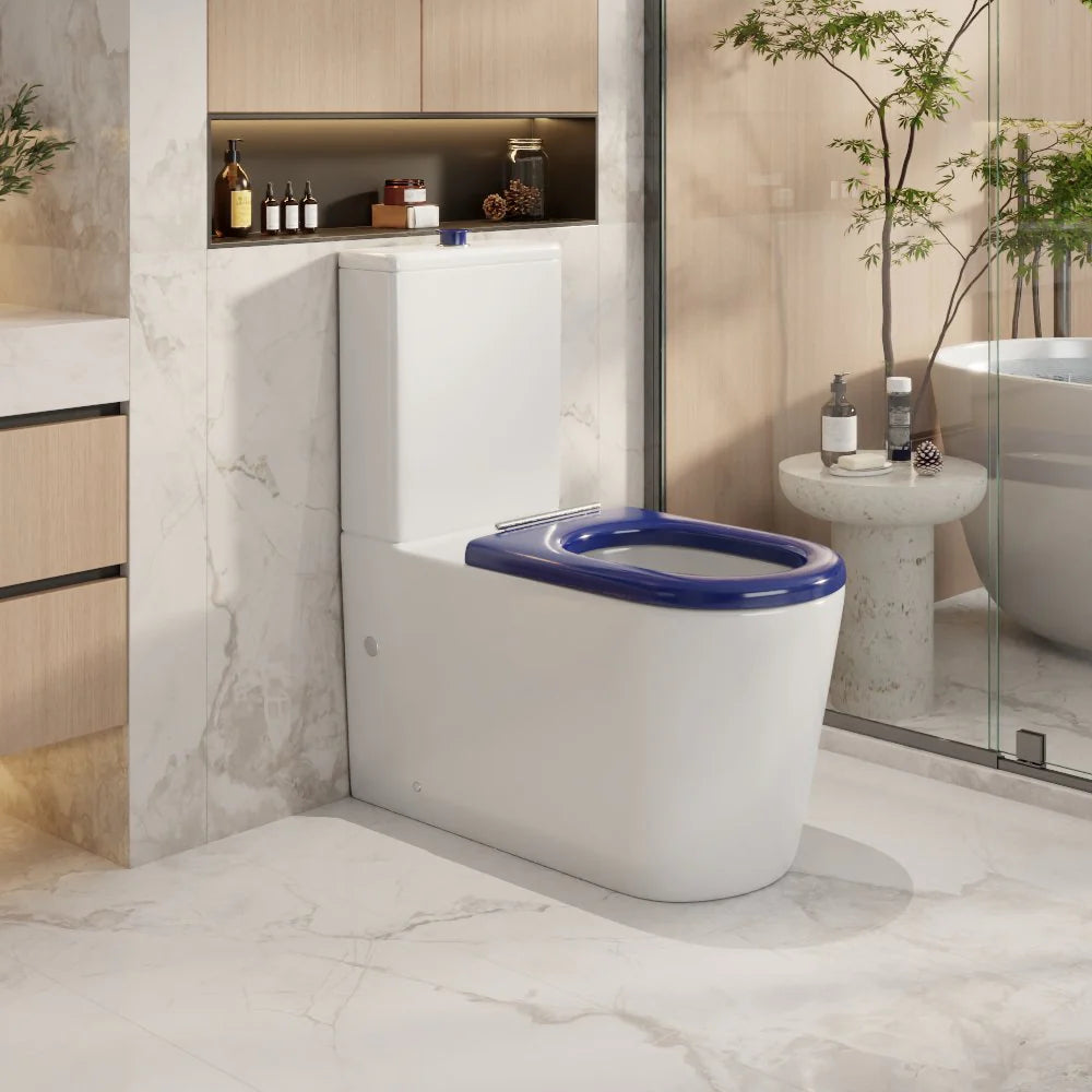 Modern bathroom with a white toilet and blue seat cover.
