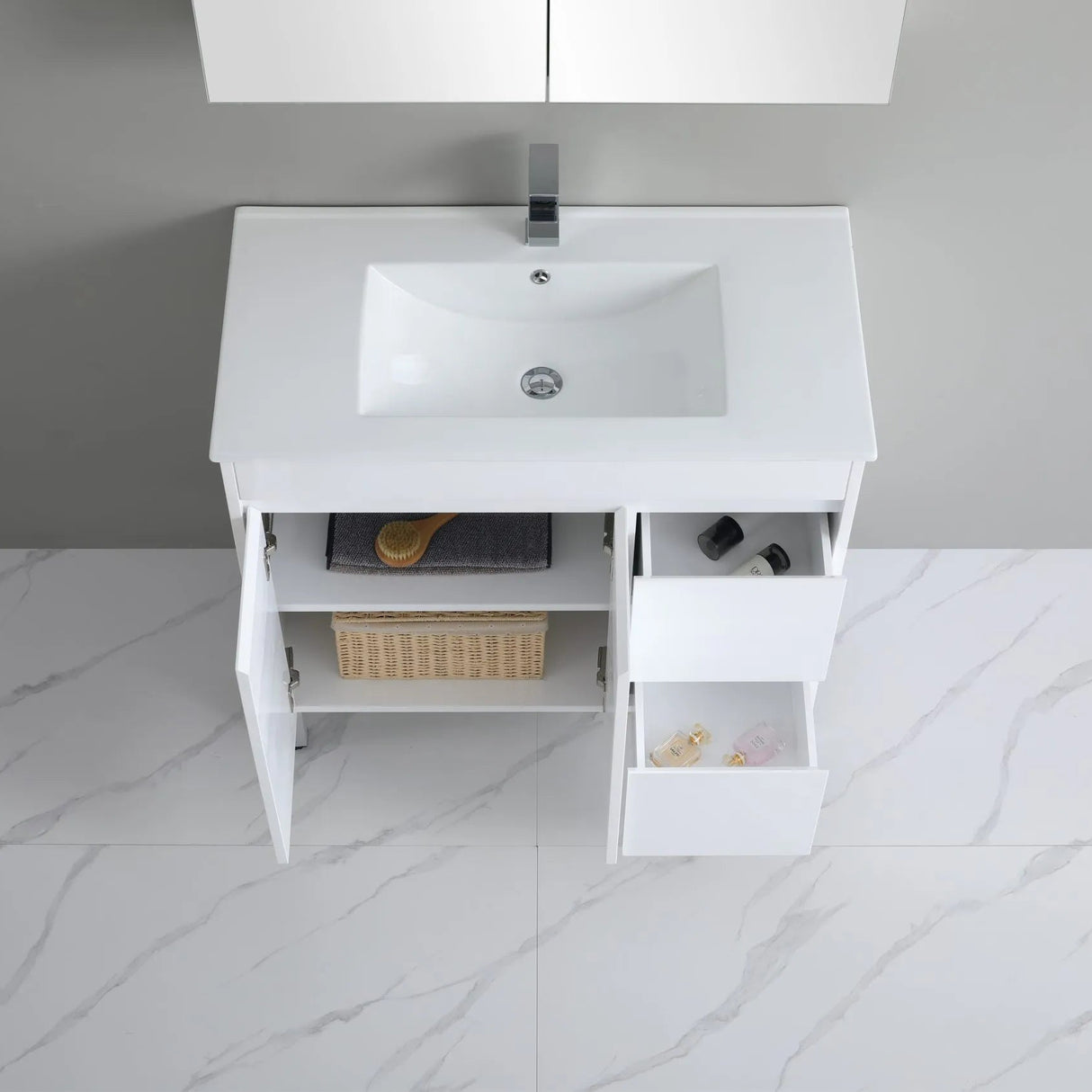 White bathroom vanity with sink on a tiled floor