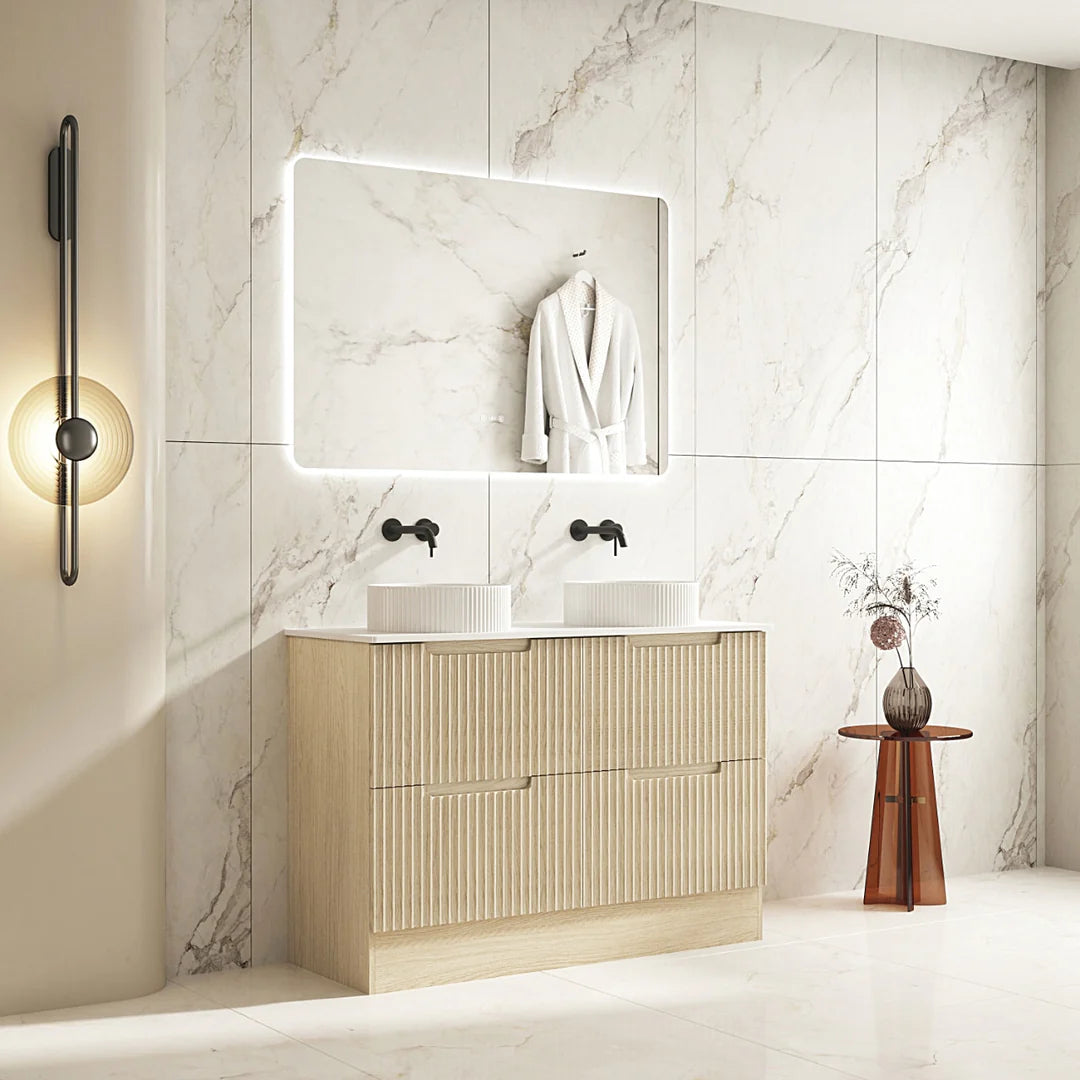 Bathroom with wooden vanity, mirror, and light fixture.