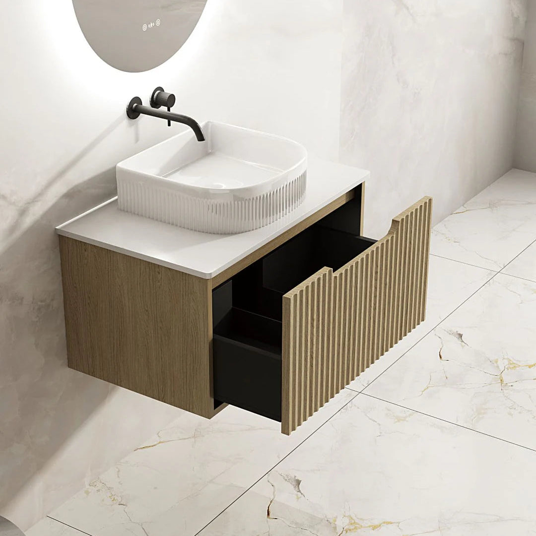 Bathroom vanity with sink and open drawer on a tiled floor