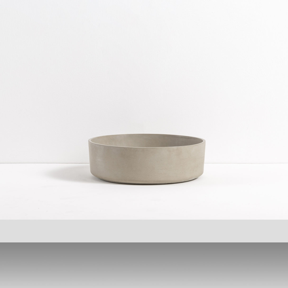 ARLO Round Concrete Basin in Concrete, featuring a minimalist and smooth circular design with a natural concrete finish, perfect for modern bathroom interiors.