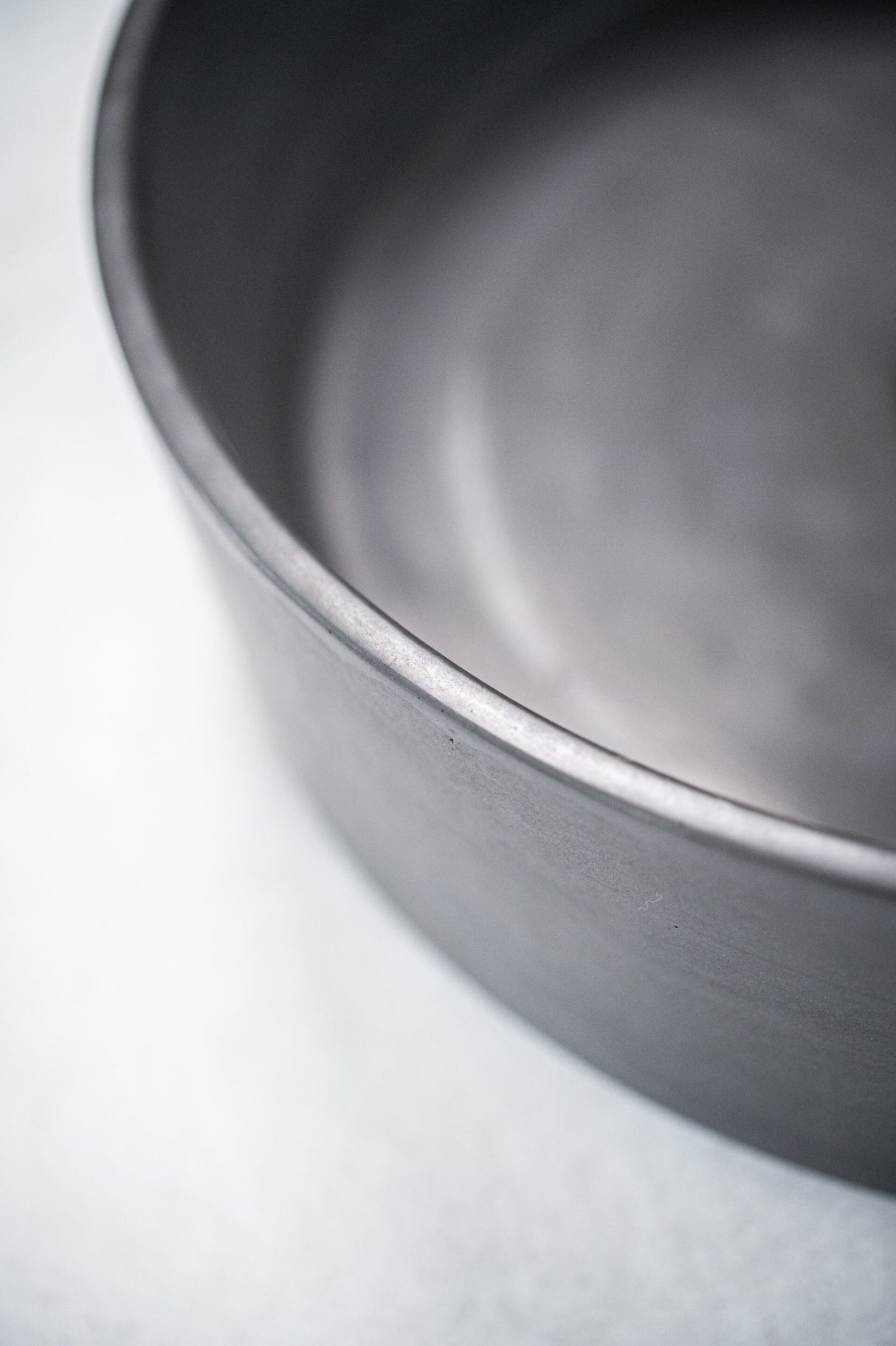 Close-up detail of the ARLO Round Concrete Basin in Charcoal, emphasizing its smooth matte surface and finely crafted edges, perfect for a modern bathroom aesthetic.