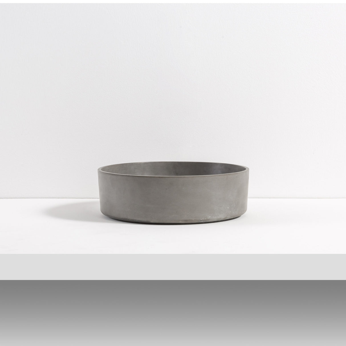 ARLO Round Concrete Basin in Grey, featuring a minimalist design with a smooth matte finish, perfect for modern and contemporary bathroom aesthetics.
