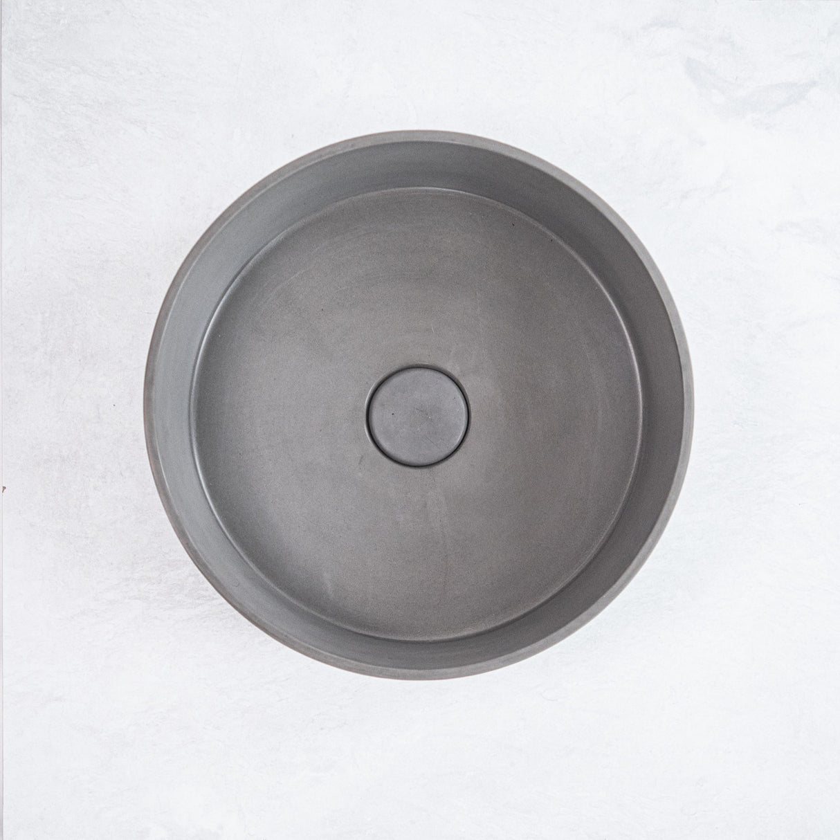 ARLO Round Concrete Basin in Grey, featuring a sleek and minimalist design perfect for enhancing contemporary bathroom aesthetics.