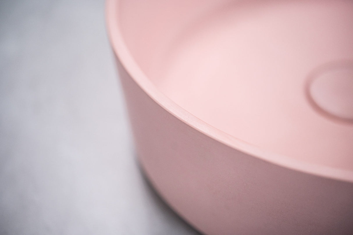 Close-up detail of the ARLO Round Concrete Basin in Dusty Pink, highlighting its smooth curved edge and matte finish for a refined and elegant bathroom design.