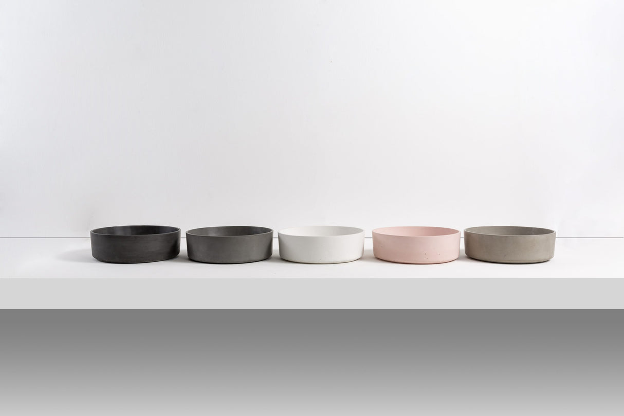 ARLO Round Concrete Basin collection showcasing a range of modern colors including Charcoal, Grey, White, Dusty Pink, and Cement, ideal for contemporary bathroom designs.