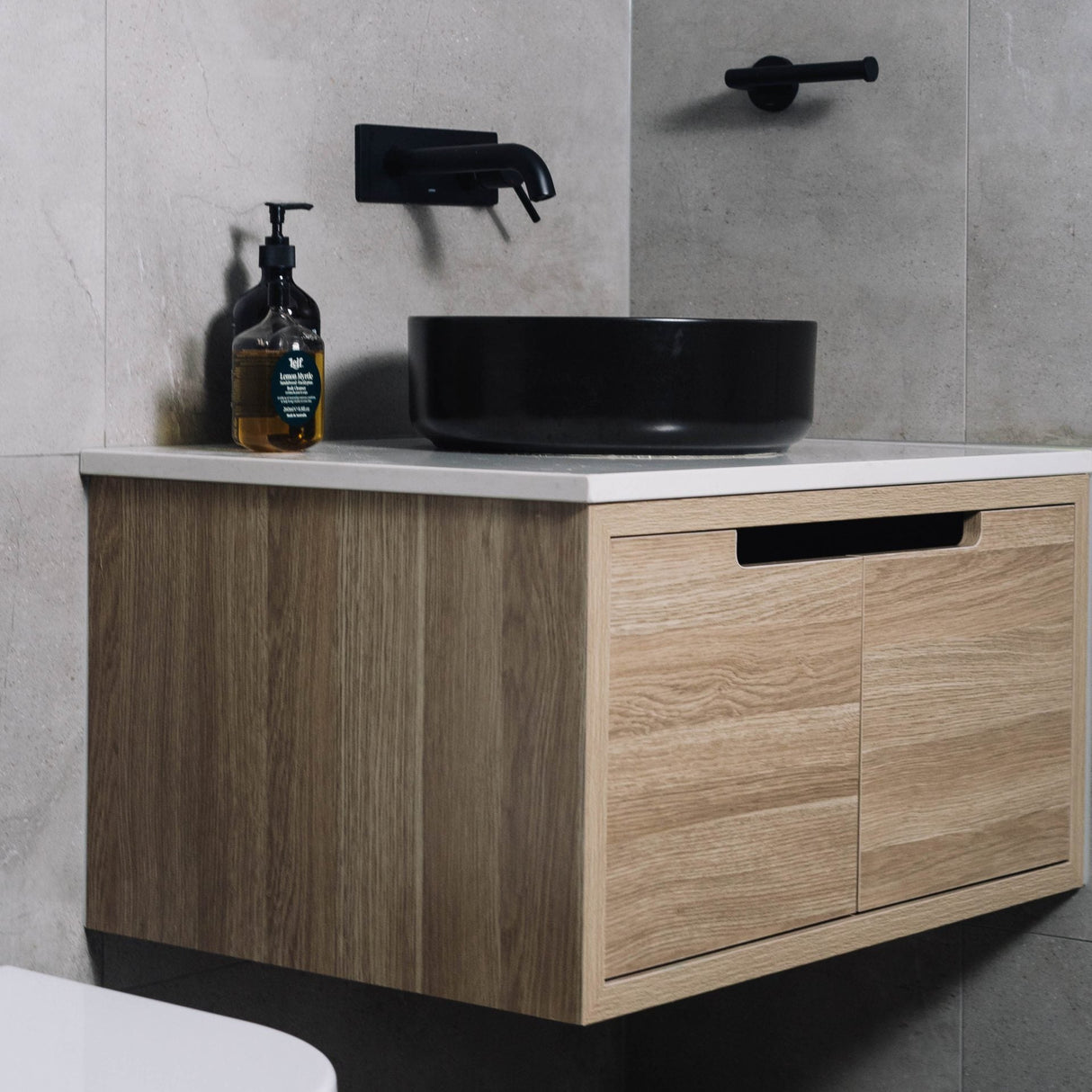 side view of Kaia Wall Hung Vanity 900mm - Light Oak installed in the bathroom
