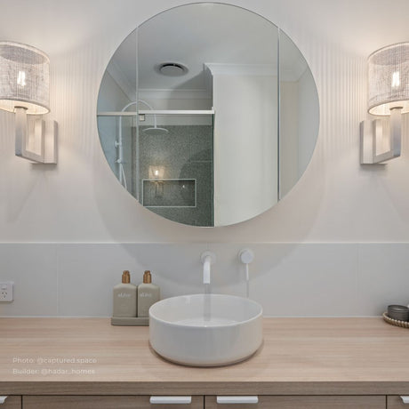 Bathroom with white basin and Mirage Round Mirror Shaving Cabinet 600mm - Frameless