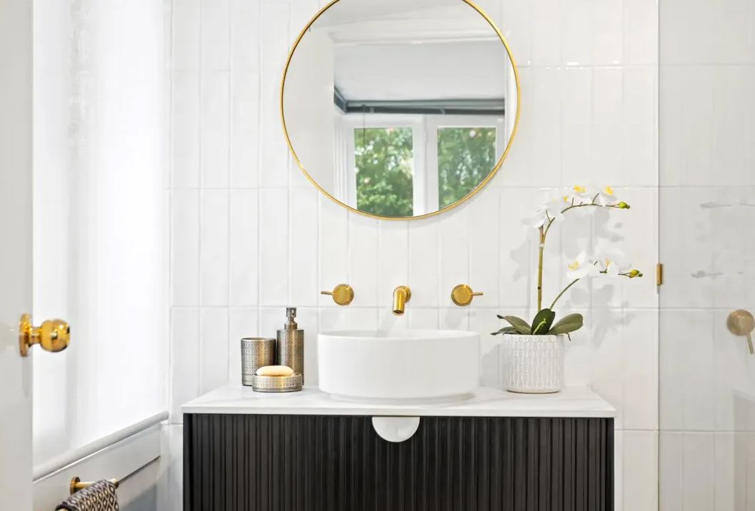 bathroom with gold frame circular mirror and wall hung Marlo Vanity 900mm - Matte Black