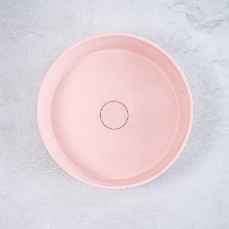 ARLO Round Concrete Basin in Dusty Pink, featuring a smooth circular design with a soft matte finish, adding a touch of elegance and modern charm to any bathroom