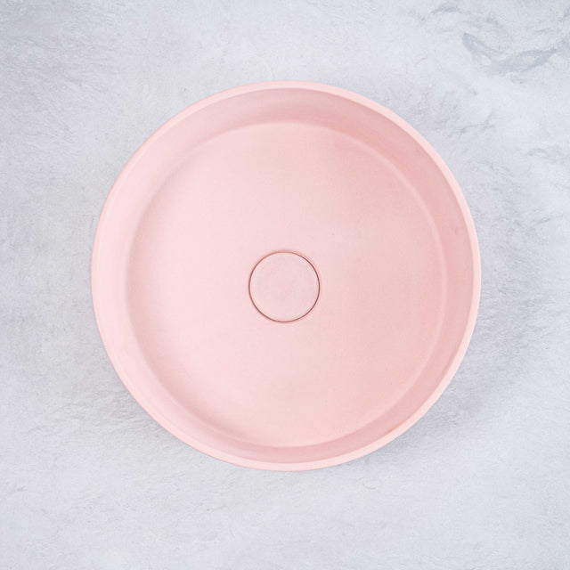 ARLO Round Concrete Basin in Dusty Pink, featuring a smooth circular design with a soft matte finish, adding a touch of elegance and modern charm to any bathroom