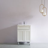 White bathroom vanity with sink against a white wall with modern pendant lights.