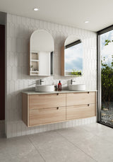 Bathroom with wooden vanity, white countertop, and large windows.