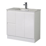 White bathroom vanity with sink and faucet on a white background