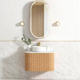 Bathroom with installed mirror and vanity 