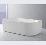 White freestanding bathtub in a modern bathroom setting