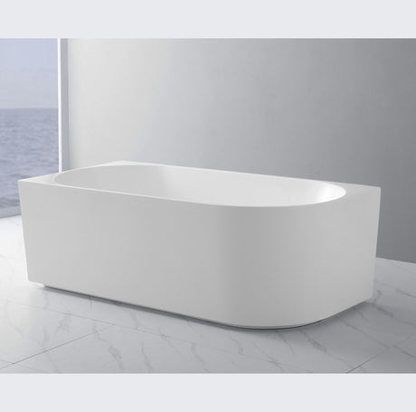 White freestanding bathtub in a modern bathroom setting
