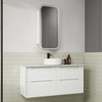 Bathroom vanity with white cabinet, round sink, and mirror above in a tiled bathroom.
