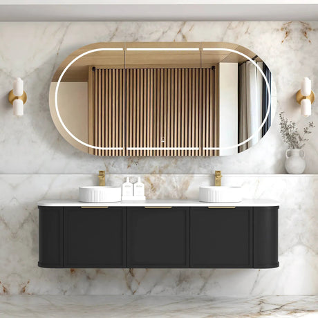 Modern wall hung vanity with a black finish and a mirrored door, featuring brushed gold handles and a wood panel accent on the top.