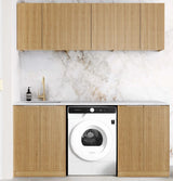 Modern kitchen with wooden cabinets and a washing machine.