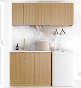 Modern kitchen with wooden cabinets, marble backsplash, and white appliances.