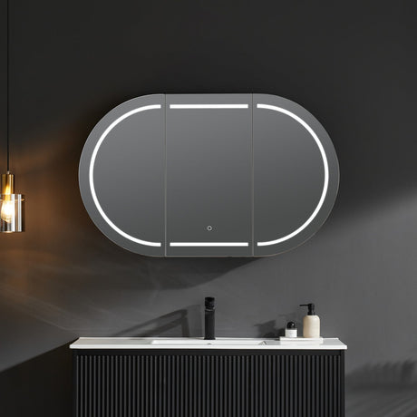 Bathroom vanity with a large oval mirror featuring LED lighting on a dark wall.