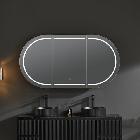 Bathroom vanity with a large oval mirror and a hanging light fixture.