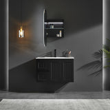 Modern bathroom setup with dark vanity, mirror, and lighting fixture.