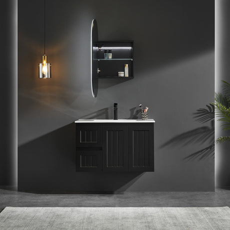Modern bathroom setup with dark vanity, mirror, and lighting fixture.