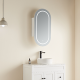 Bathroom setup with a sink, mirror, and hanging light fixture on a beige wall.