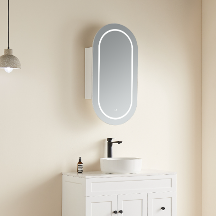 Bathroom setup with a sink, mirror, and hanging light fixture on a beige wall.