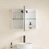 Bathroom with a white cabinet, sink, and toiletries on a beige wall.