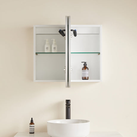 Bathroom with a white cabinet, sink, and toiletries on a beige wall.