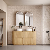 Bathroom with wooden vanity, double mirrors, and decorative elements.