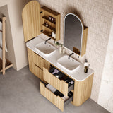 Bathroom vanity with double sink, mirror, and storage cabinets.