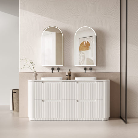 Bathroom vanity with two sinks, mirrors, and decorative elements.