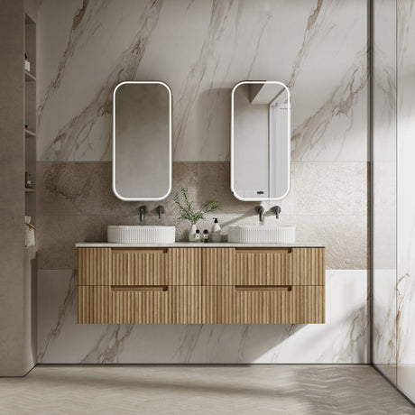 Bathroom vanity with wooden cabinet, two sinks, and mirrors against a marble wall.