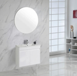 Bathroom with white vanity, round mirror, and marble walls.