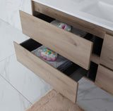 Wooden drawer with colorful items inside on a light-colored floor.