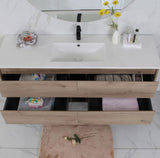 Bathroom vanity with white countertop, wooden drawers, and mirror.