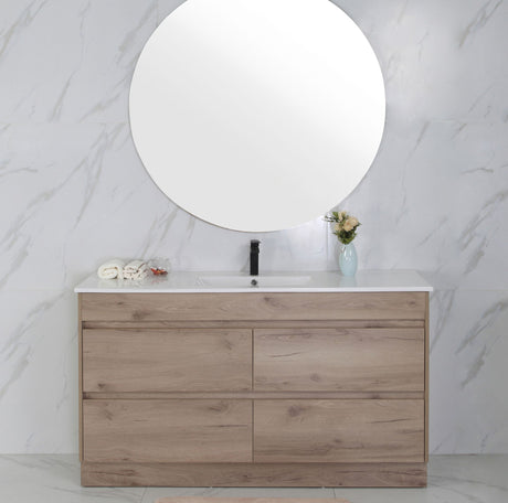 Bathroom vanity with wooden finish and round mirror on marble wall