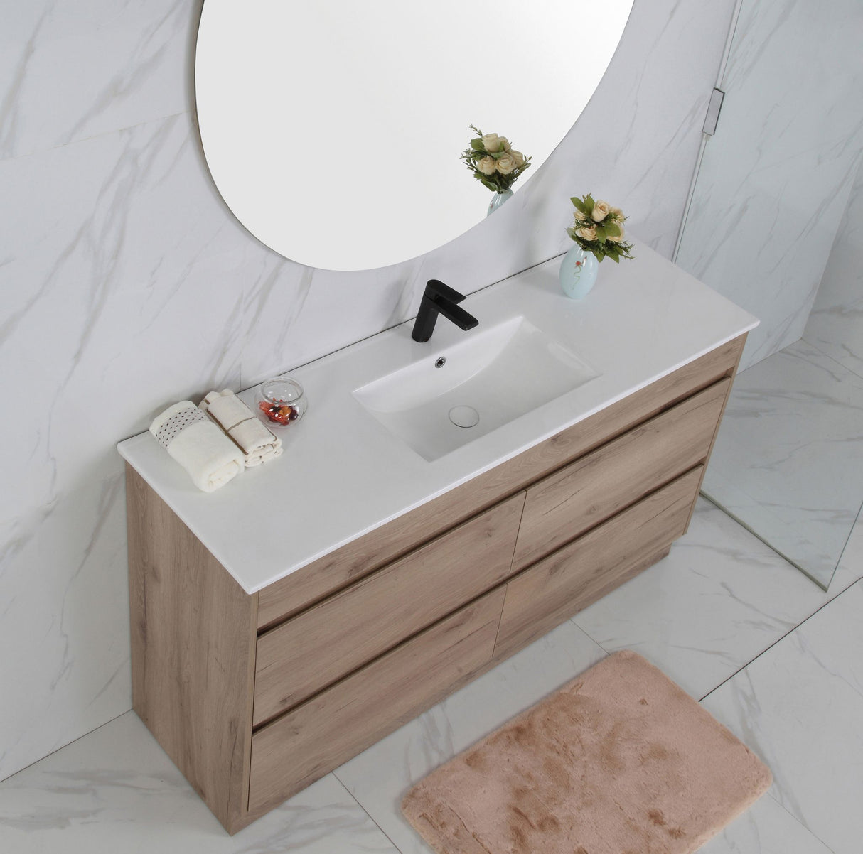 Bathroom vanity with white countertop, wooden cabinet, and round mirror.