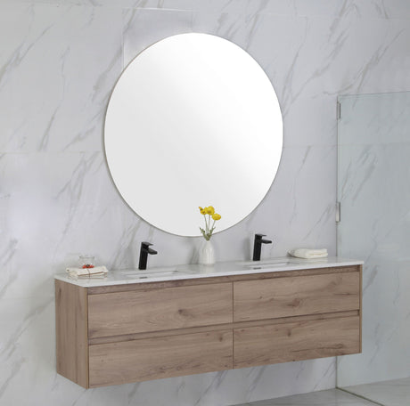 Bathroom vanity with round mirror and marble wall