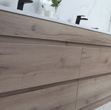 Wooden bathroom vanity with a mirror above it