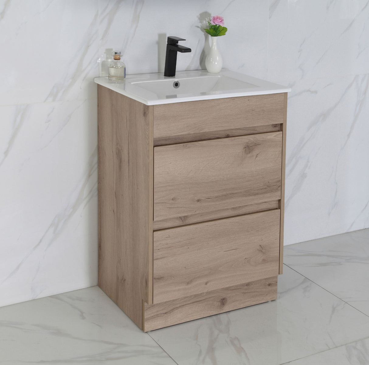 Wooden bathroom vanity with sink against a marble wall