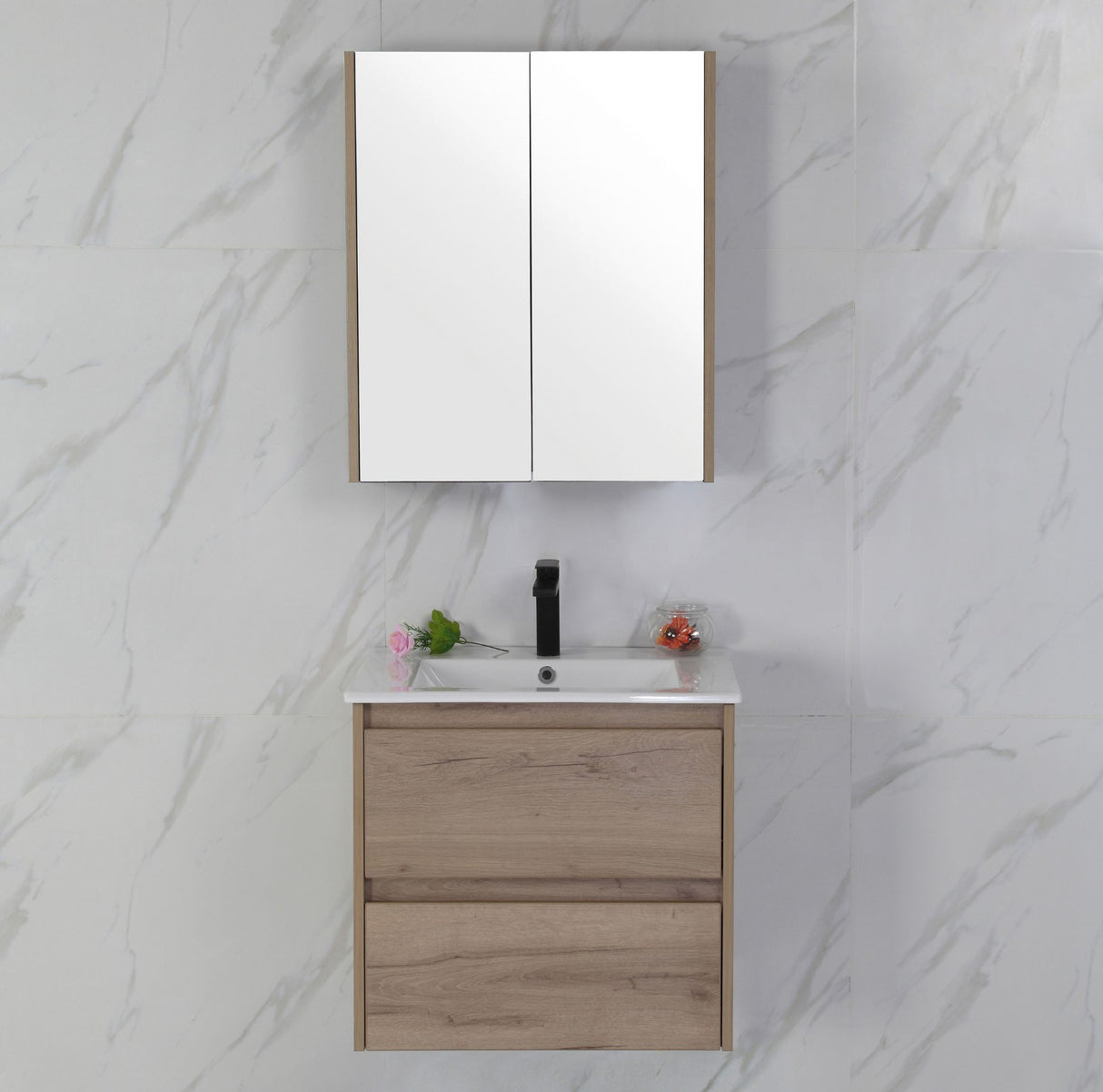 Bathroom vanity with mirror and sink against a marble wall