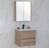 Bathroom vanity with mirror cabinet against a marble wall.